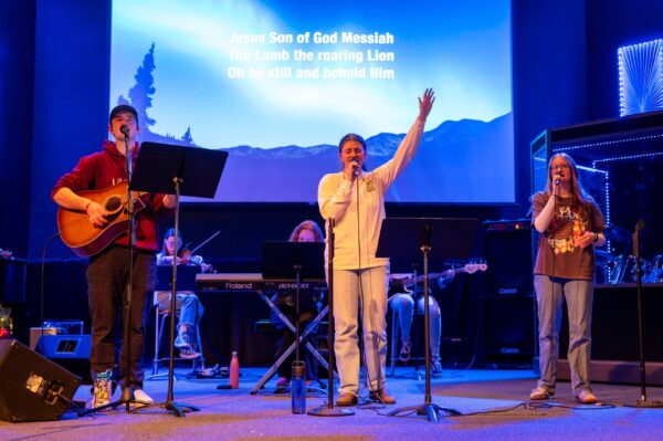 Investing in Action - Delaney leading worship